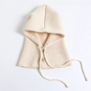 Close-up of knit texture and button details on off-white balaclava winter hood