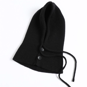 Detail of black rib-knit balaclava scarf showing double button closure and drawstring