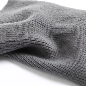 Close-up of grey ribbed knit texture and thick woolen fabric details of the Balaclava hat