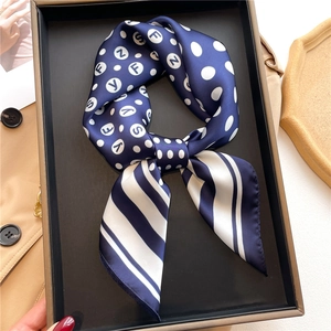 Navy blue silk scarf with polka dots and letter print in a black gift box
