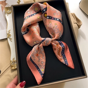 Detail of silk-like square scarf with sun and moon vintage print in elegant gift box