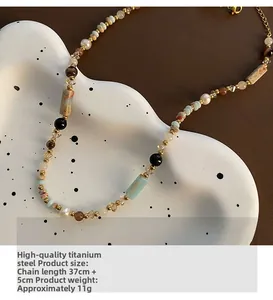 Detailed shot of ethnic beaded necklace with colorful stones and titanium steel lobster clasp