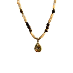 Vintage teardrop necklace with tiger eye beads and shell cylinder accents in gold finish