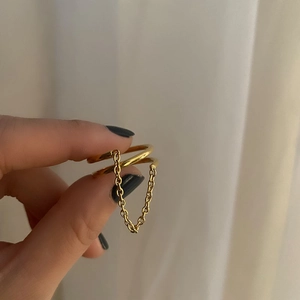 Elegant gold titanium steel double ring featuring a unique fine chain link decoration