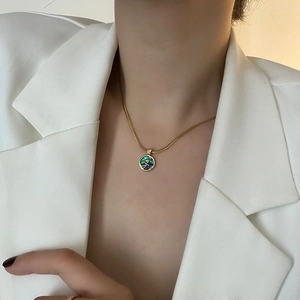Elegant gold titanium steel necklace featuring a rose relief abalone shell pendant