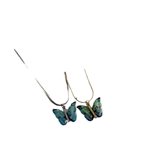 Ensemble de colliers pendentifs papillon exquis en or et argent avec zircon bleu brillant