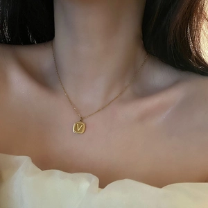Elegant gold titanium steel necklace with V-letter square pendant on a delicate chain