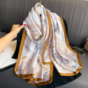 Elegant large floral silk-like scarf with blue prints and champagne gold borders