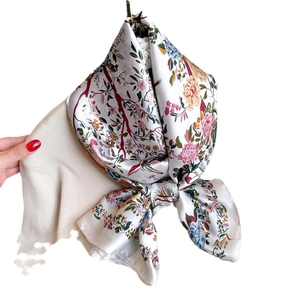 Elegant floral print silk-feel shawl with cranes on a soft knit cream sweater