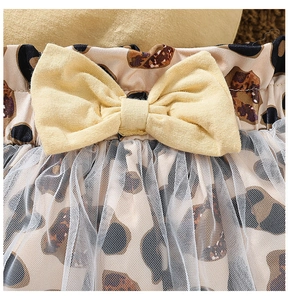 Detail of baby leopard print bloomer with large yellow bow and white mesh overlay