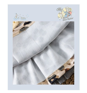Detail of baby dress hem showing leopard print layer and soft light blue mesh fabric