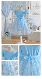 Detail of blue unicorn tulle dress showing mesh layers and matching headband accessory