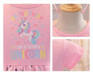 Detail of pink girls' unicorn dress showing neck stitching and soft tulle skirt texture