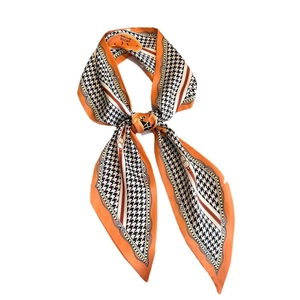 Elegant houndstooth narrow scarf in orange and black with horse motif equestrian print