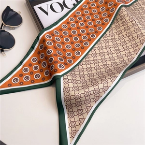Elegant silk scarf with orange geometric circle patterns and vintage French style