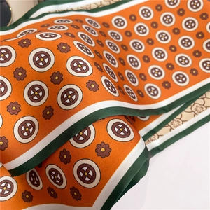 Chic orange silk-like scarf with vintage geometric prints and contrast striped edges