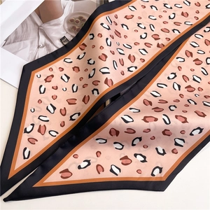 Pink leopard print skinny silk scarf with black contrast borders for versatile styling