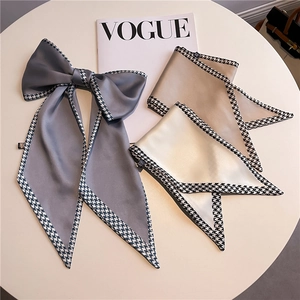 Elegant satin skinny scarves with houndstooth borders in grey, gold, and ivory colors