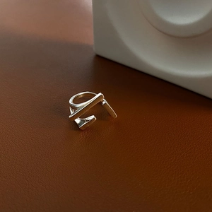 Minimalist S925 sterling silver geometric ring with linear design on leather background