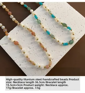 Detail of strawberry crystal beaded necklace set with titanium steel gold accents
