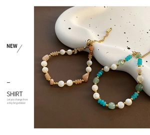 Detail of beaded natural stone necklaces with gold lobster clasp and adjustable chain