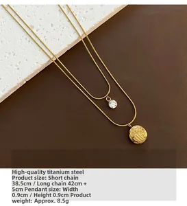 Detailed view of titanium double-layer gold necklace with Fu character and zircon pendant
