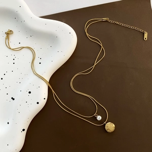 Gold double-layered necklace with zircon pendant and Fu character coin in titanium steel