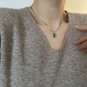 Elegant gold snake chain necklace with iridescent abalone shell teardrop pendant