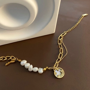 Baroque natural pearl bracelet with golden key charm and smiling face pendant for women