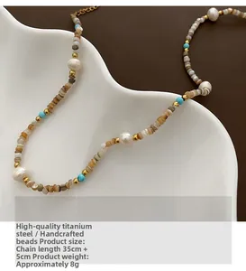 Detail of luxury beaded necklace with natural pearls and turquoise on a white tray