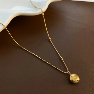 Gold minimalist titanium steel necklace featuring a unique mixed chain and a round pendant