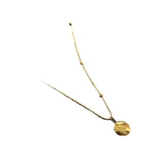 Gold titanium necklace featuring a faceted round pendant and a delicate beaded chain design