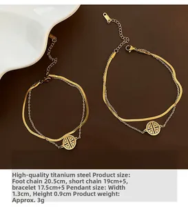 Detail view of double-layered gold titanium steel anklet with geometric hollow pendant