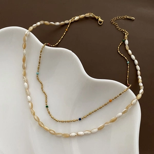 Double-layered colorful shell bead necklace with gold lobster clasp and extension chain