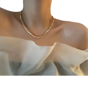 Elegant double-layered beaded necklace with creamy pearls and fine gold chain