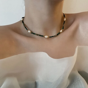 Handmade necklace with dark green turquoise beads and natural pearls on stainless steel