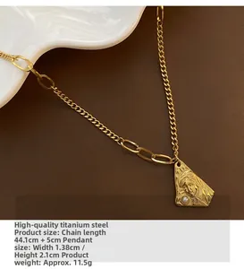 Macro detail of titanium steel necklace with portrait relief pendant and pearl accent