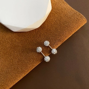 Luxurious double-sided zircon silver earrings on a brown suede and white stone setting