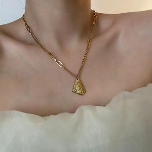 Elegant gold titanium steel necklace with female portrait pendant and small pearl accent