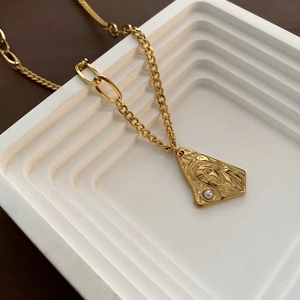 Gold titanium steel necklace with Virgin Mary relief pendant and asymmetric chain