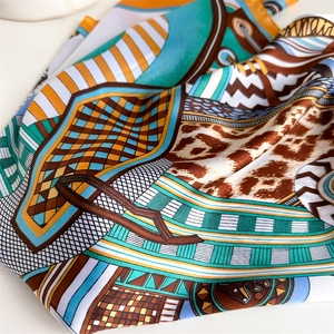 70x70cm faux silk scarf with orange and cyan equestrian graffiti print in a soft fold