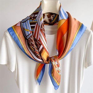 Elegant geometric horse head pattern silk scarf for women in vibrant orange and blue