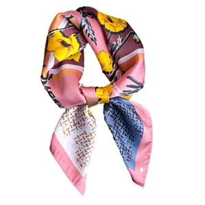 Silk-like floral scarf with yellow flowers and geometric patterns on a soft pink base