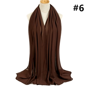 Detailed view of dark brown chiffon hijab showing premium texture and soft drape