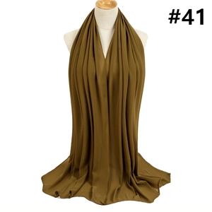 Detailed drape of olive green chiffon hijab scarf on white mannequin torso