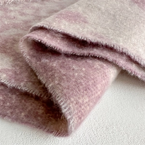 Macro shot of fluffy lavender tie-dye wool-like fabric with soft fringed edges