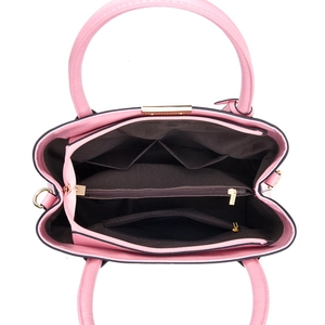 Internal view of pink handbag showing multi-functional compartments and dark brown lining