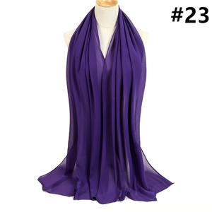 Vertical folds of high-quality purple chiffon fabric draped on a beige female mannequin