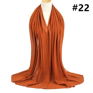 Detailed close-up of caramel chiffon headscarf showing lightweight texture and soft drape