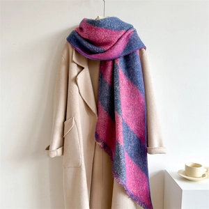 Detail of pink and blue checkered scarf texture with soft fringe and thick cashmere feel